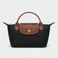 Mini-Handtasche mit Lederdetails und Goldverschluss -    Zorenza