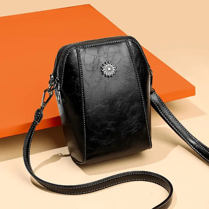 Kleine Crossbody-Tasche in Lederoptik mit mehreren Fächern – Verstellbarer Riemen Zorenza