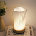 Tischleuchte mit Wellendesign und LED-Licht -    Zorenza
